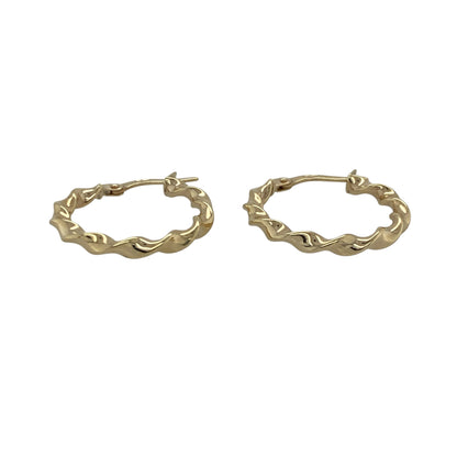 Bring elegant movement and warm golden shine to your collection with these pre-owned 9ct yellow gold ribbon-twisted creole earrings—an attractive pair offering timeless charm and refined style.

Design: These hoop creole earrings feature a delicate ribbon-twist pattern, creating a flowing, light-catching look with subtle texture.
Material: Made from 9-carat yellow gold, the polished finish enhances their radiant tone and highlights the graceful twist design.