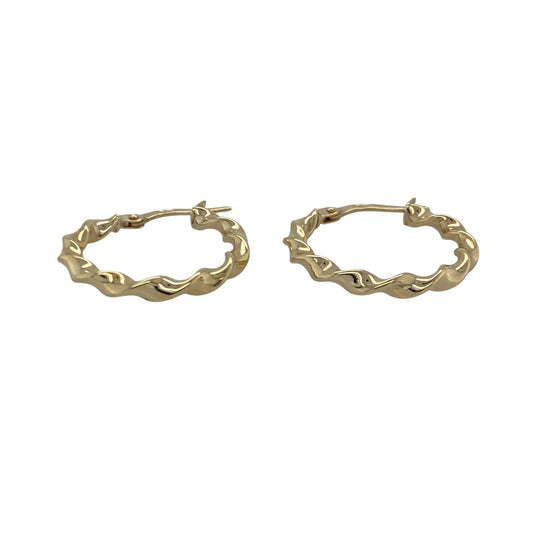 Bring elegant movement and warm golden shine to your collection with these pre-owned 9ct yellow gold ribbon-twisted creole earrings—an attractive pair offering timeless charm and refined style.

Design: These hoop creole earrings feature a delicate ribbon-twist pattern, creating a flowing, light-catching look with subtle texture.
Material: Made from 9-carat yellow gold, the polished finish enhances their radiant tone and highlights the graceful twist design.