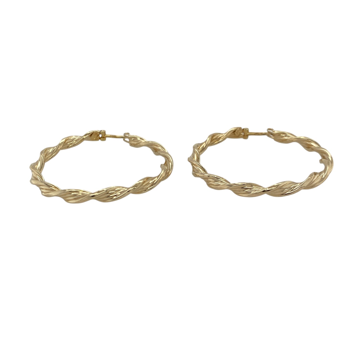 Bring graceful movement and warm golden shine to your collection with these pre-owned 9ct yellow gold ribbon-twisted creole earrings—an elegant pair offering timeless style and refined detail.

Design: These hoop creole earrings feature a flowing ribbon-twist pattern, creating soft curves and light-catching texture for a beautifully feminine look.
Material: Made from 9-carat yellow gold, the polished surfaces enhance their rich golden tone and highlight the twisting design.