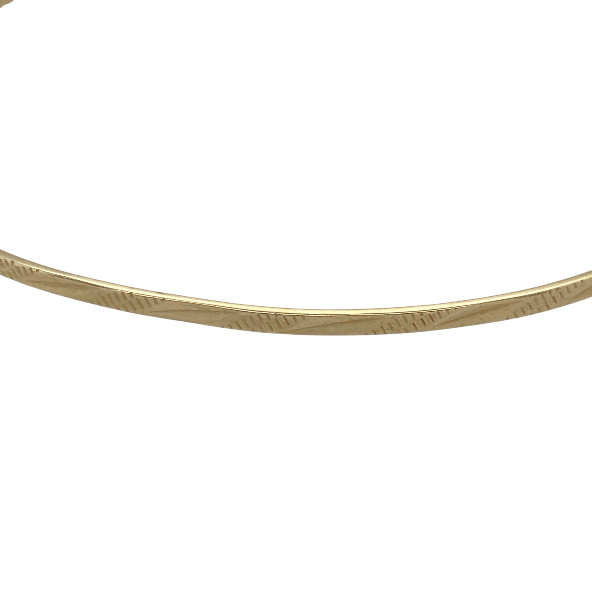 Bring elegant texture and warm golden shine to your collection with this pre-owned 9ct yellow solid gold patterned bangle—an attractive piece offering timeless style and refined detail.

Design: This bangle features a delicate 2mm patterned finish, adding subtle depth and visual interest to its classic circular form.
Material: Made from solid 9-carat yellow gold, the polished surface enhances its radiant, long-lasting shine.