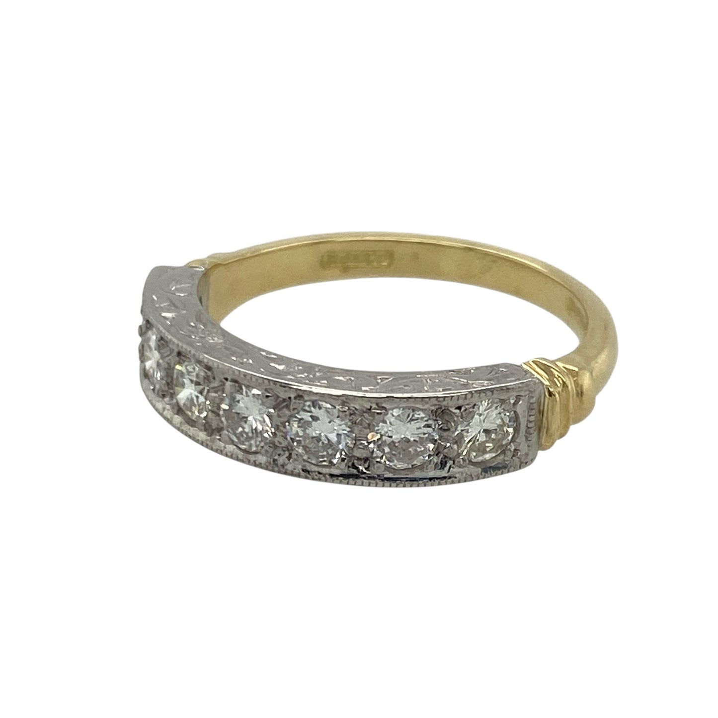 Bring exceptional brilliance and timeless elegance to your collection with this pre-owned 18ct yellow and white gold seven-stone diamond band ring—an exquisite piece offering luxurious sparkle and refined style.

Design: This size M band features a 6mm wide front set with seven brilliant-cut diamonds, each approximately 0.11ct, creating a beautifully balanced row of bright, continuous sparkle.