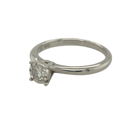 Bring classic sparkle and refined elegance to your collection with this pre-owned 9ct white gold diamond solitaire ring—an attractive piece offering timeless beauty and understated brilliance.

Design: This size N ring features an illusion-set brilliant-cut diamond of approximately 0.17ct, enhancing the stone’s appearance and creating a bright, eye-catching focal point.
