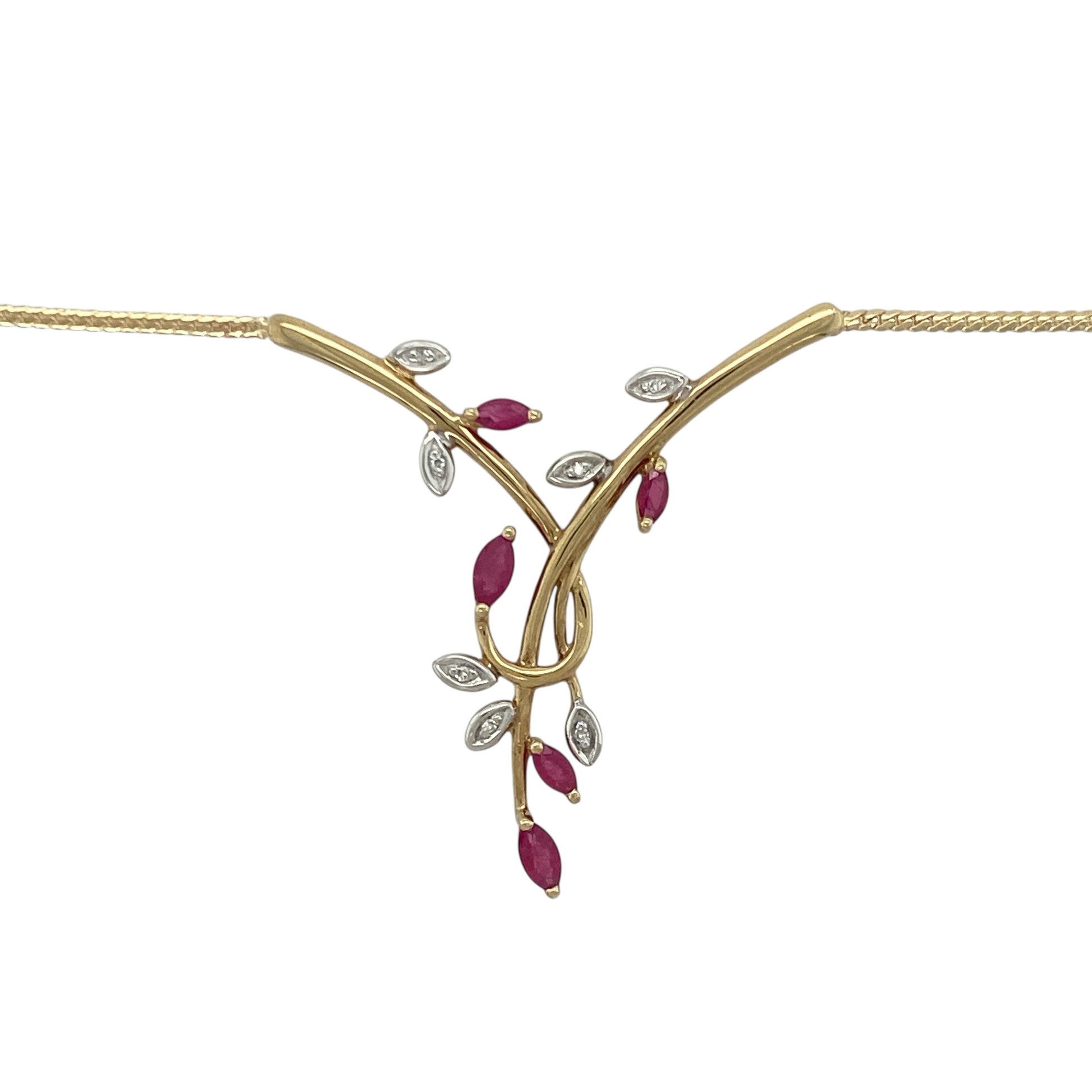 Bring rich colour and elegant sparkle to your collection with this pre-owned 9ct yellow gold ruby and diamond leaf-style necklace—an attractive piece offering timeless charm and refined detail.

Design: This 16" necklace features a flat snake chain adorned with a delicate leaf-style arrangement of rubies and diamonds, creating a graceful, nature-inspired focal point with vibrant colour and subtle brilliance.