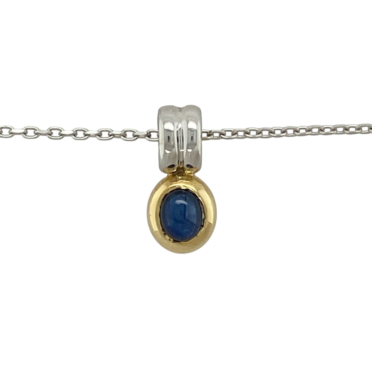 Bring elegant colour and refined two-tone detail to your collection with this pre-owned 18ct white and yellow gold blue stone pendant necklace—an attractive piece offering timeless beauty and graceful sophistication.

Design: This oval pendant features a 5mm by 4mm sapphire-coloured blue stone framed in a smooth, classic setting, creating a bright and beautifully balanced focal point.