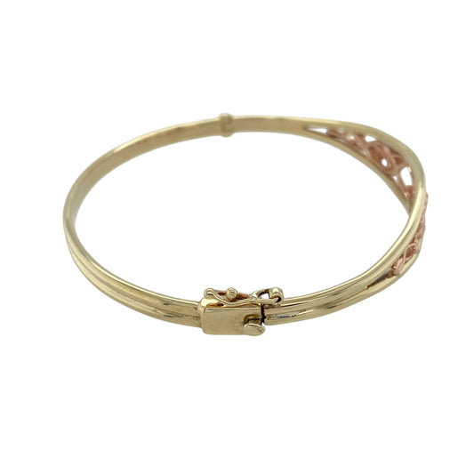 Bring heritage beauty and symbolic elegance to your collection with this pre-owned 9ct yellow and rose gold Clogau Tree of Life bangle—a meaningful design combining nature-inspired detail with timeless craftsmanship.

Design: The bangle features a polished front panel measuring 11mm in height, adorned with the iconic Tree of Life motif in yellow and rose gold, symbolising growth, strength, and connection.