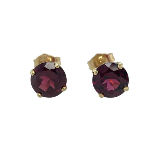 Bring vibrant colour and classic sparkle to your accessory collection with these pre-owned 9ct yellow gold round red stone stud earrings — a timeless pair with bold, elegant presence.

Design: Each earring features a 6mm round ruby-coloured stone, offering rich, eye-catching colour in a simple and classic stud style.
Material: Made from 9ct yellow gold, the polished finish adds warmth and beautifully complements the deep red tones of the stones.