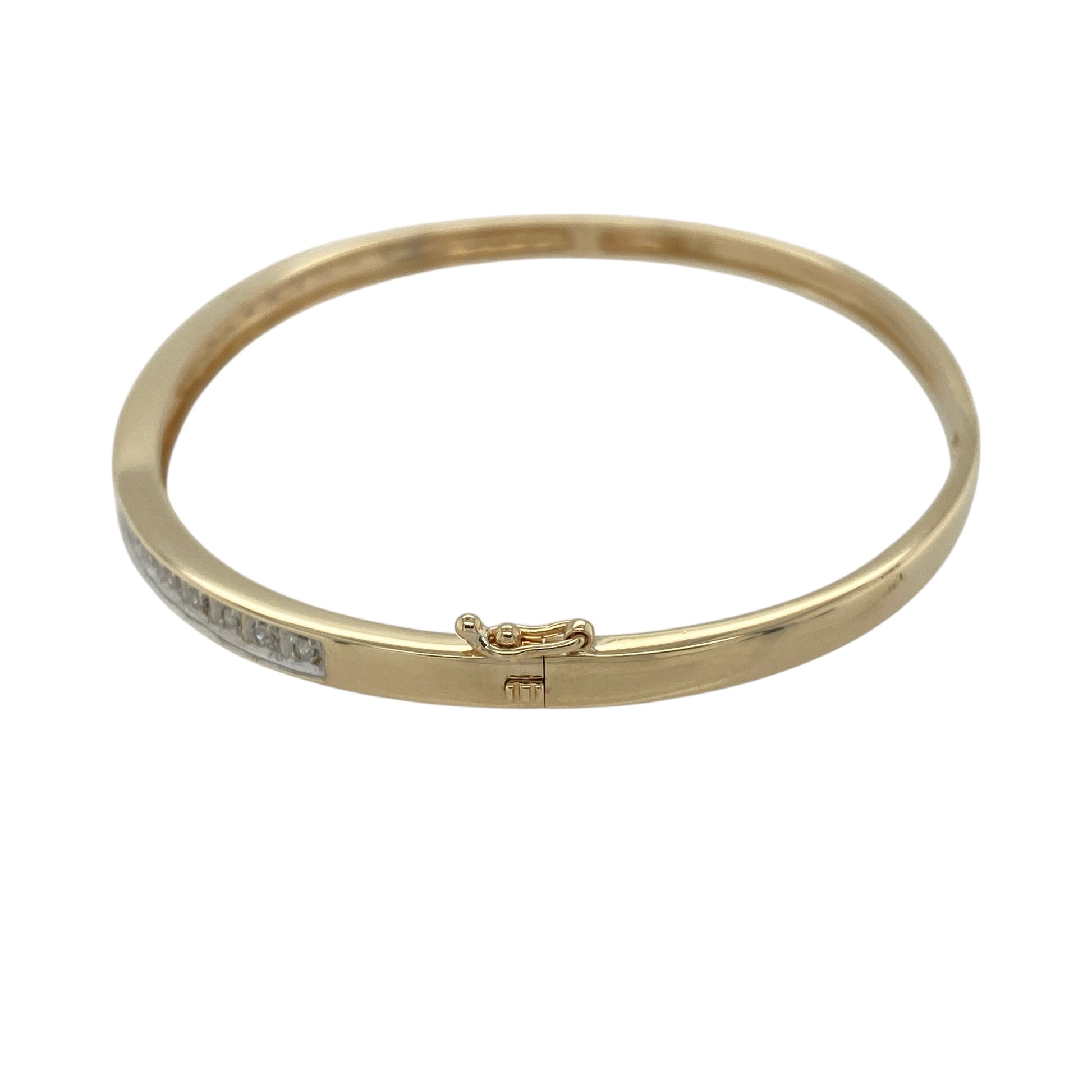 Bring refined sparkle and modern elegance to your jewellery collection with this pre-owned 9ct yellow and white gold diamond pavé set hinged bangle — a sleek and sophisticated piece with timeless appeal.

Design: The bangle is 3mm wide and features a pavé diamond section that adds bright, delicate shimmer while maintaining a smooth, contemporary profile.
Material: Made from 9ct yellow and white gold, the two-tone finish enhances the clean design and beautifully complements the sparkle of the pavé diamonds.
