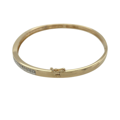 Bring refined sparkle and modern elegance to your jewellery collection with this pre-owned 9ct yellow and white gold diamond pavé set hinged bangle — a sleek and sophisticated piece with timeless appeal.

Design: The bangle is 3mm wide and features a pavé diamond section that adds bright, delicate shimmer while maintaining a smooth, contemporary profile.
Material: Made from 9ct yellow and white gold, the two-tone finish enhances the clean design and beautifully complements the sparkle of the pavé diamonds.

