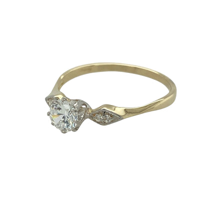 Bring classic sparkle and timeless simplicity to your jewellery collection with this pre-owned 9ct yellow gold cubic zirconia solitaire ring — an elegant piece with bright, refined detail.

Design: The ring features a 5mm round cubic zirconia at the centre, complemented by two smaller stones set on the shoulders for added sparkle and balance.
Material: Made from 9ct yellow gold, the polished finish enhances the warm tone of the band and beautifully complements the brilliance of the stones.