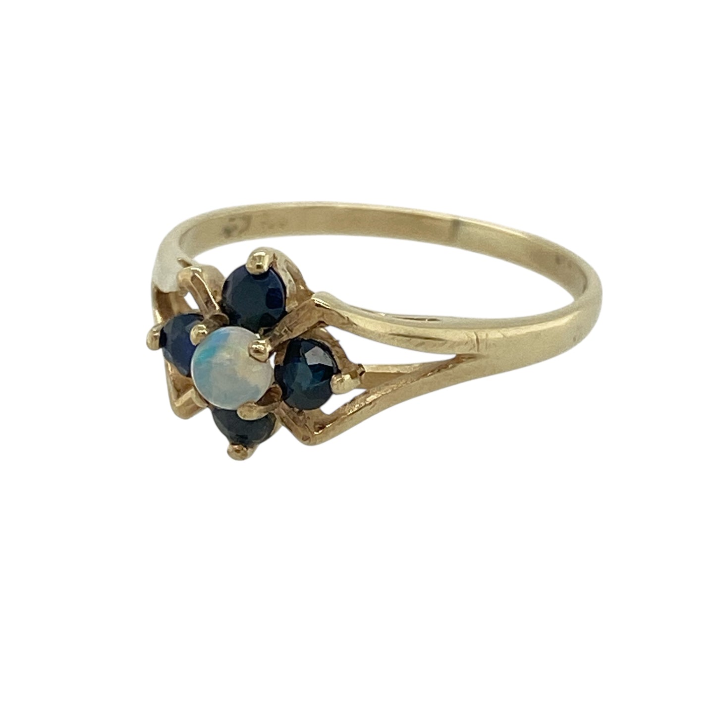 Bring soft colour and delicate sparkle to your jewellery collection with this pre-owned 9ct yellow gold opalique and sapphire flower ring — a pretty piece with gentle, feminine charm.

Design: The ring features a 3mm round opalique stone at the centre, surrounded by small sapphires arranged in a dainty flower shape for a sweet and elegant finish.