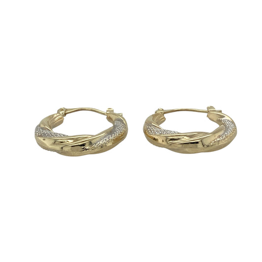 Bring sleek style and modern contrast to your accessory collection with these pre-owned 9ct yellow and white gold twisted hoop creole earrings — a contemporary pair with elegant movement.

Design: Each earring features a gently twisted hoop shape that blends yellow and white gold for a refined two-tone effect with added visual interest.
Material: Made from 9ct yellow and white gold, the polished finish enhances the smooth twists and highlights the stylish contrast between the metals.