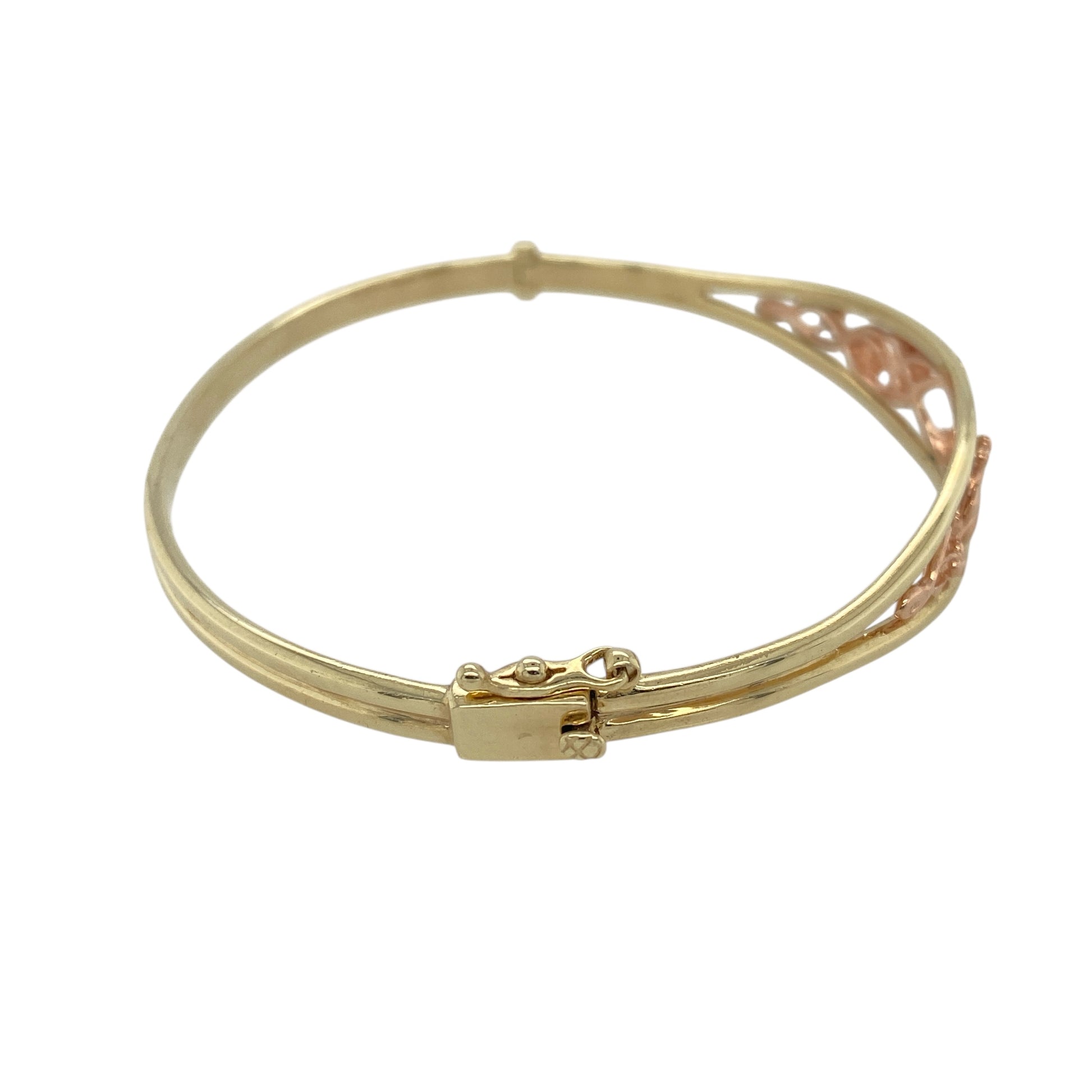 Bring heritage beauty and symbolic elegance to your collection with this pre-owned 9ct yellow and rose gold Clogau Tree of Life bangle—a meaningful design combining nature-inspired detail with timeless craftsmanship.

Design: The bangle features a polished front panel measuring 11mm in height, adorned with the iconic Tree of Life motif in yellow and rose gold, symbolising growth, strength, and connection.