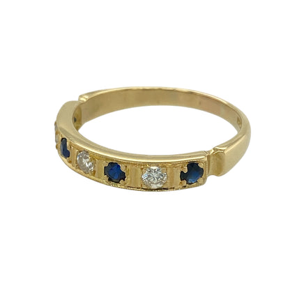Bring refined colour and classic sparkle to your jewellery collection with this pre-owned 18ct yellow gold diamond and sapphire band ring — an elegant piece with timeless sophistication.

Design: The front of the 3.5mm wide band features a harmonious row of three sapphires and three diamonds, creating a balanced blend of deep blue colour and bright sparkle.
