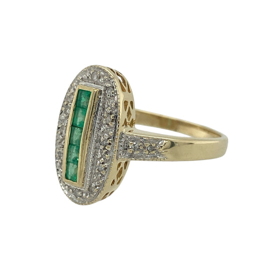 Bring vintage glamour and elegant colour to your jewellery collection with this pre-owned 9ct yellow and white gold diamond and emerald Art Deco style ring — a striking piece with bold geometric charm.

Design: The front of the ring measures 16mm high and features a long oval Art Deco design set with square emerald stones, each approximately 2mm by 2mm, complemented by sparkling diamonds for added brilliance and contrast.