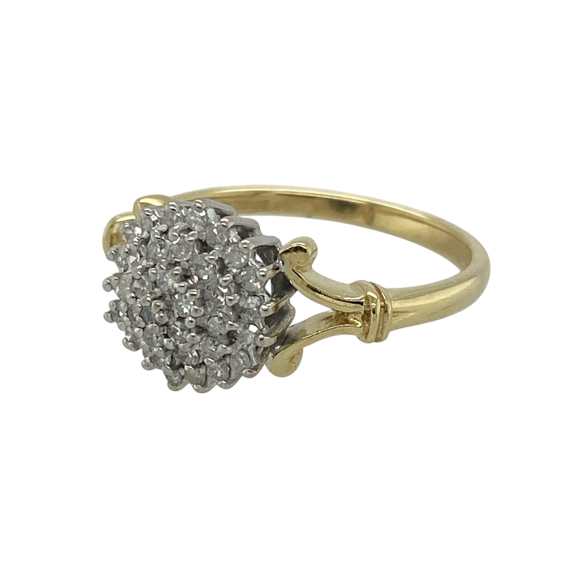 Bring timeless sparkle and elegant presence to your jewellery collection with this pre-owned 18ct yellow gold diamond cluster ring — a classic piece with bright, luxurious brilliance.

Design: The front of the ring measures 10mm high and features a beautifully arranged diamond cluster, creating a radiant focal point with vintage-inspired charm.
Material: Made from 18ct yellow gold, the rich polished finish enhances the warmth of the band and complements the bright sparkle of the diamonds.