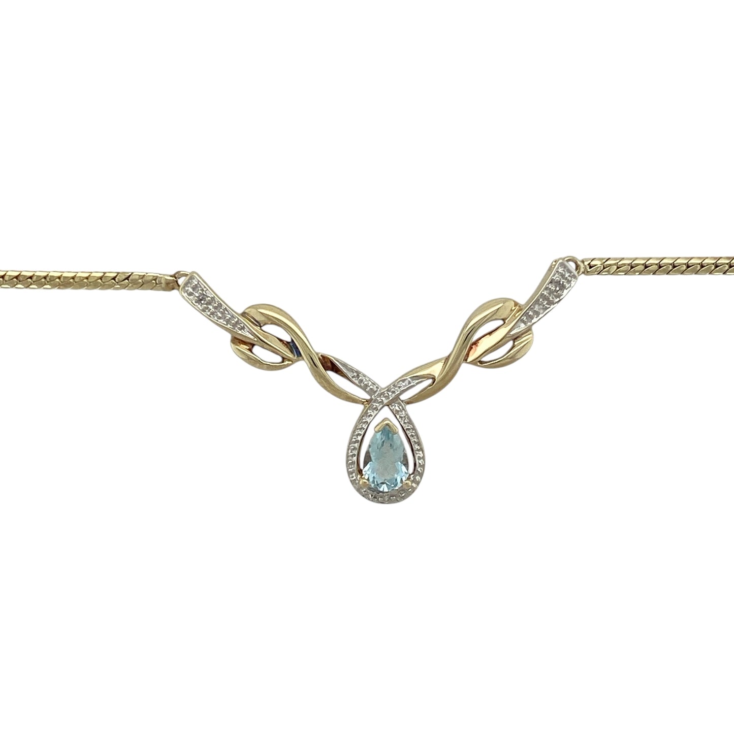 Bring vibrant colour and sleek elegance to your jewellery collection with this pre-owned 9ct yellow and white gold diamond and blue topaz flat snake necklace — a refined piece with modern shine and timeless sparkle.

Design: The necklace features a 6mm by 4mm teardrop-shaped blue topaz at the centre, highlighted with delicate diamonds for added brilliance. The flat snake chain offers a smooth, fluid look that sits beautifully against the skin.