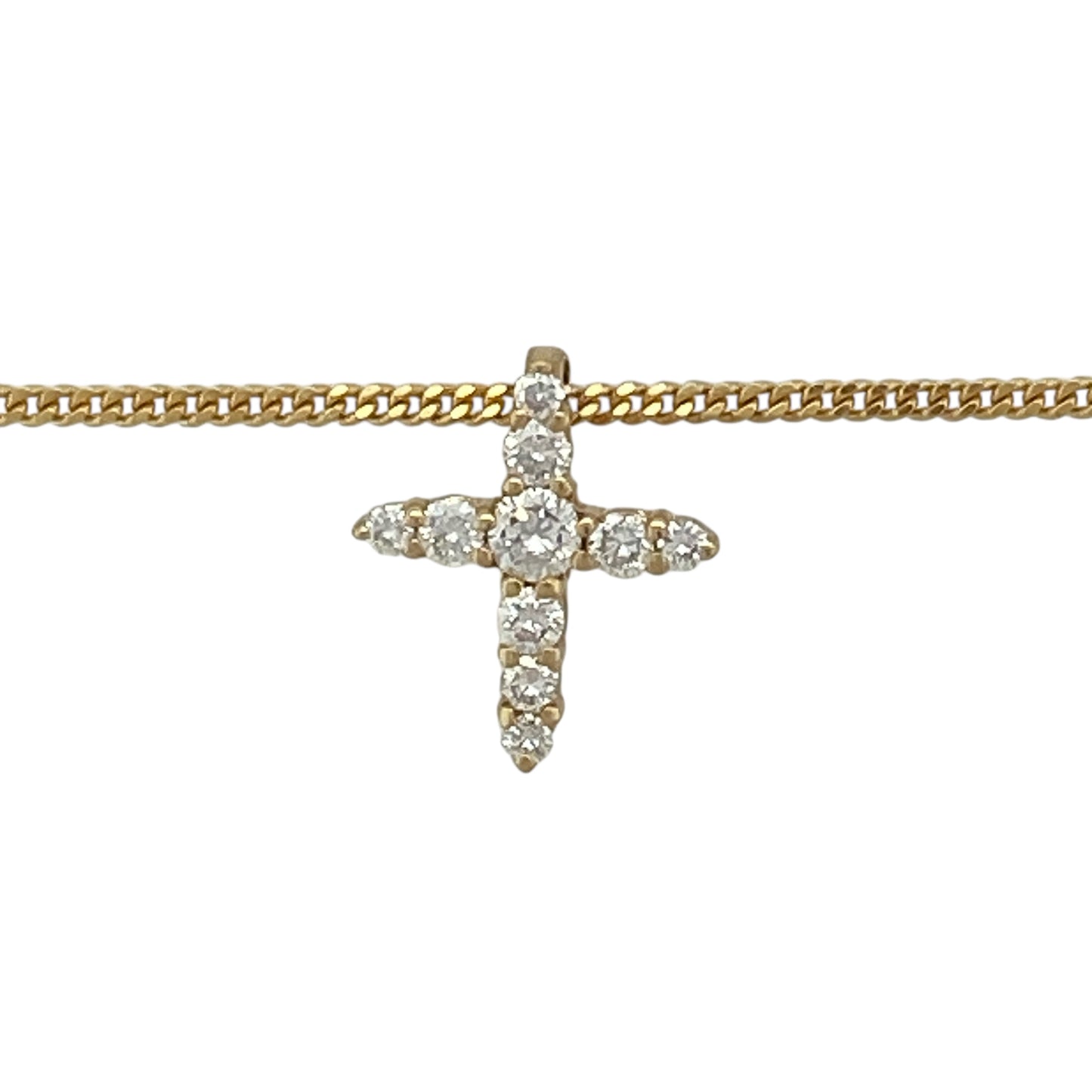 Bring timeless meaning and elegant sparkle to your jewellery collection with this pre-owned 18ct yellow gold diamond cross pendant on a 20" curb chain — a classic piece with refined, spiritual charm.

Design: The pendant measures approximately 1.2cm in length and features a delicate cross shape set with diamonds for subtle brilliance and a beautifully polished finish.
Material: Made from 18ct yellow gold, the rich, warm tone enhances the bright sparkle of the diamonds and adds a luxurious touch.
