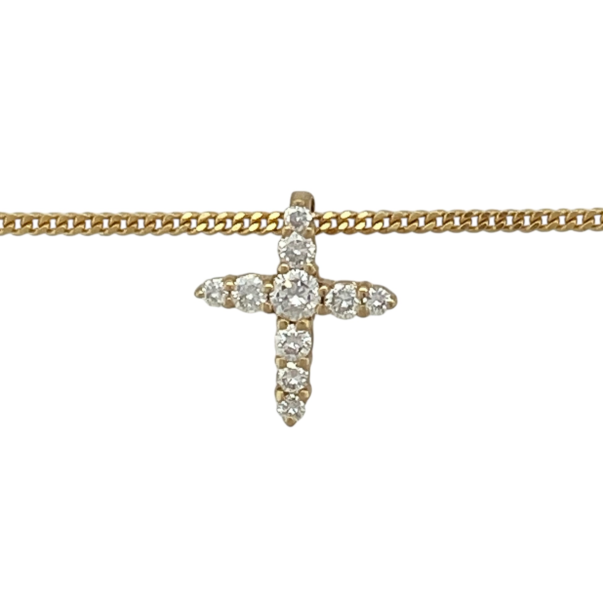 Bring timeless meaning and elegant sparkle to your jewellery collection with this pre-owned 18ct yellow gold diamond cross pendant on a 20" curb chain — a classic piece with refined, spiritual charm.

Design: The pendant measures approximately 1.2cm in length and features a delicate cross shape set with diamonds for subtle brilliance and a beautifully polished finish.
Material: Made from 18ct yellow gold, the rich, warm tone enhances the bright sparkle of the diamonds and adds a luxurious touch.