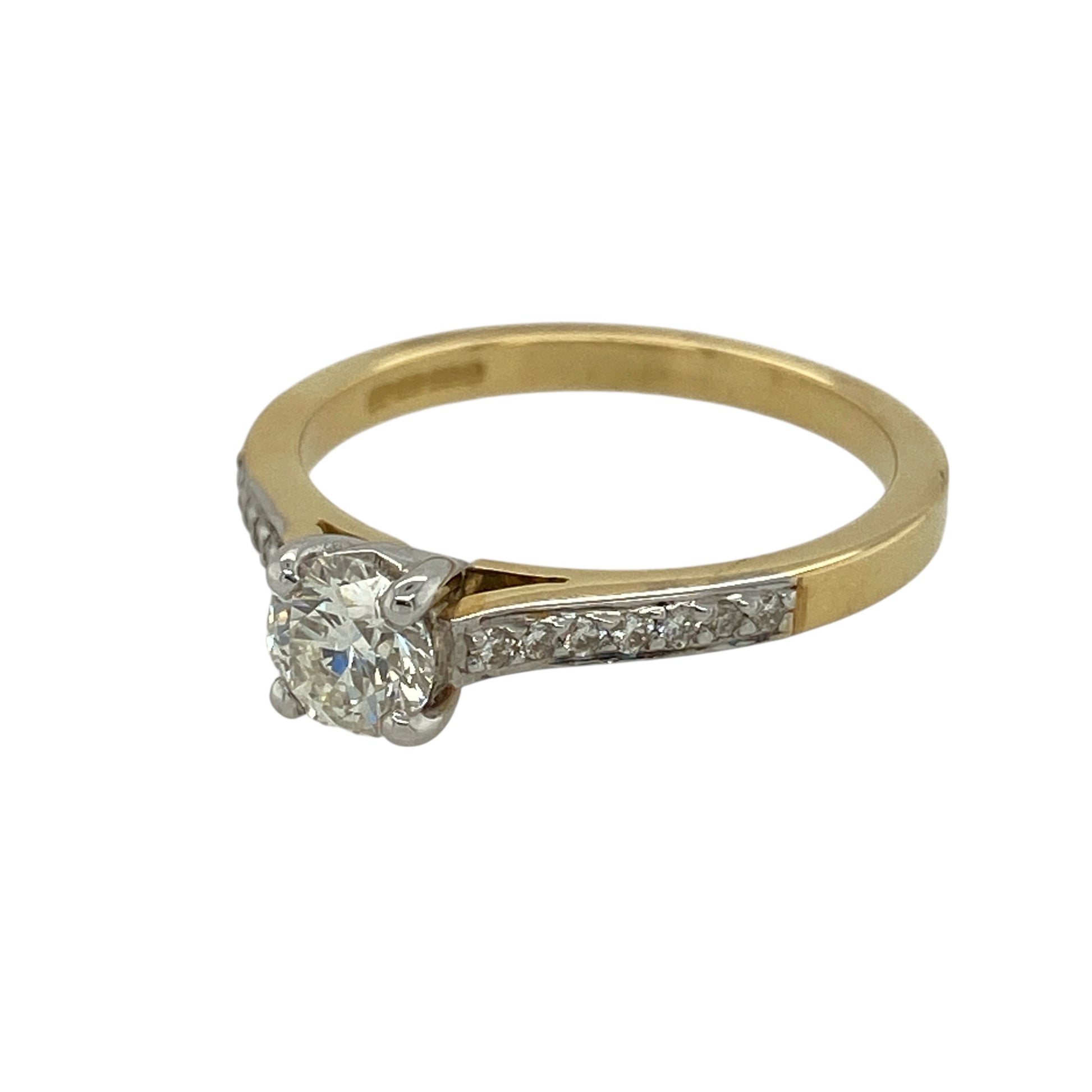 Bring classic brilliance and elegant detail to your jewellery collection with this new 9ct yellow gold diamond solitaire ring — a timeless piece with beautifully enhanced sparkle.

Design: The ring features a striking central diamond of approximately 0.64ct, complemented by diamond-set shoulders that add refined shimmer and balance to the design.
Material: Made from 9ct yellow gold, the polished finish enhances the warm tone of the band and contrasts beautifully with the bright sparkle of the diamonds.