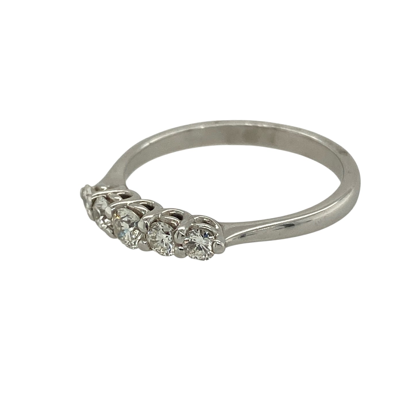 Bring elegant sparkle and timeless style to your jewellery collection with this new 18ct white gold five-stone diamond band ring — a refined piece with classic brilliance.

Design: The ring features five brilliant-cut diamonds arranged across the band, offering a balanced, radiant display with eye-catching symmetry.
Material: Made from 18ct white gold, the polished finish enhances the cool, luxurious tone of the metal and beautifully complements the diamonds’ bright sparkle.