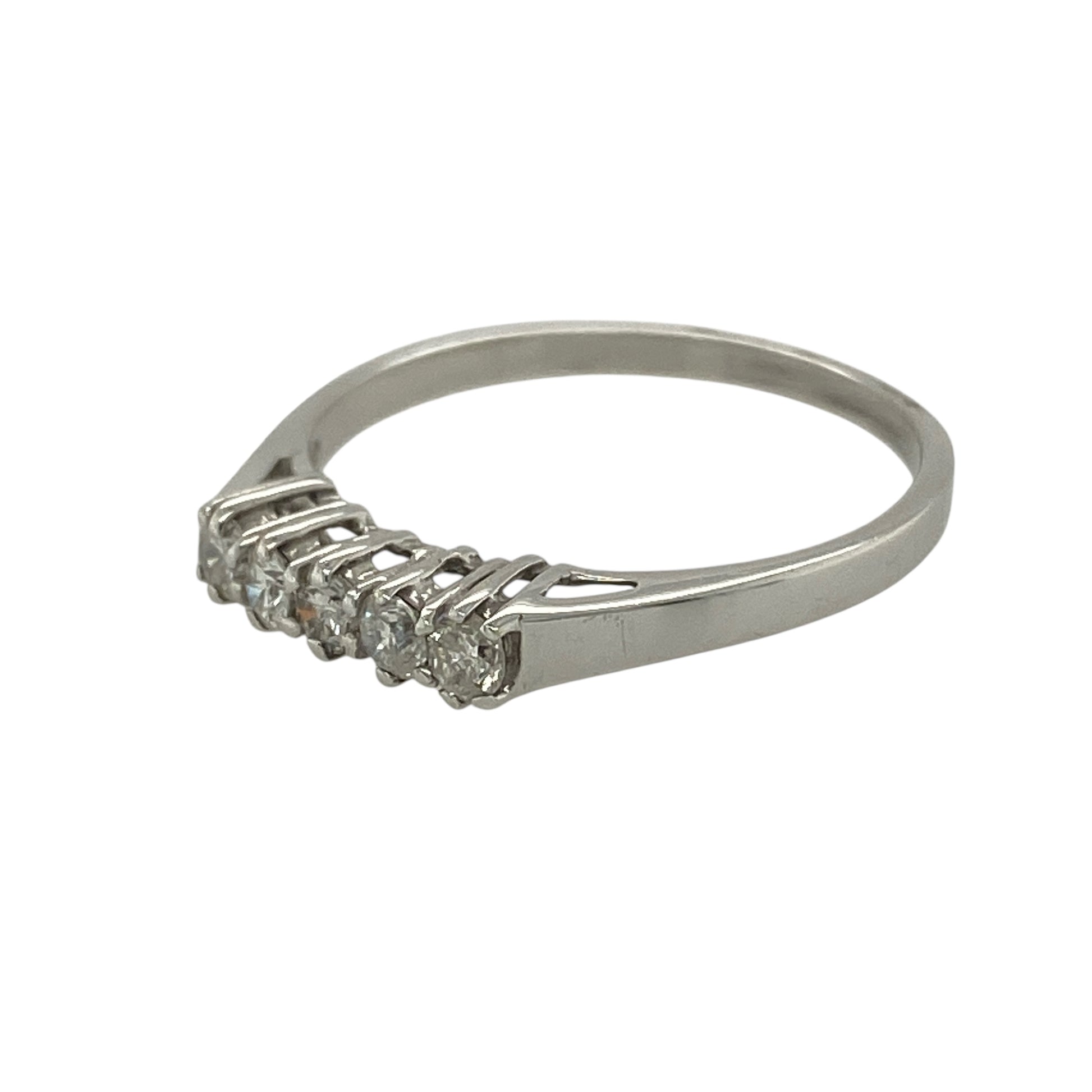 Bring classic sparkle and elegant simplicity to your jewellery collection with this new 9ct white gold five-stone diamond band ring — a timeless design with bright, refined brilliance.

Design: The ring features five brilliant-cut diamonds arranged across the band, offering a balanced and radiant display with a graceful, traditional look.
Material: Made from 9ct white gold, the polished finish enhances the cool, contemporary tone of the metal and beautifully complements the diamonds’ lively sparkle.