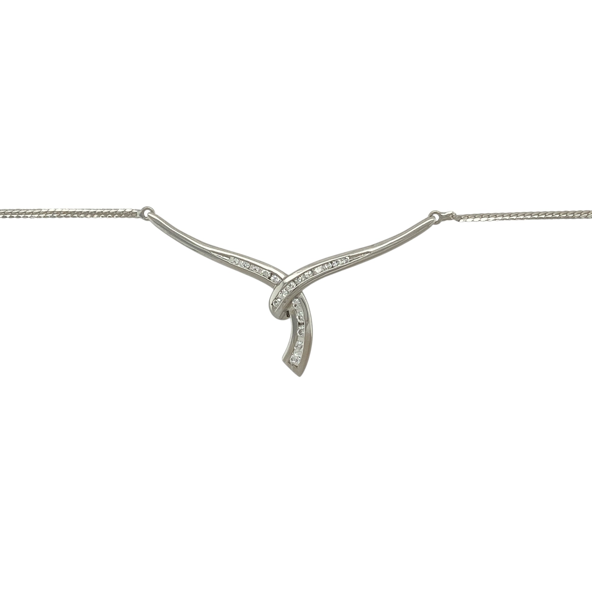 Bring refined sparkle and contemporary elegance to your collection with this pre-owned 9ct white gold cubic zirconia wrap-over Y-shaped necklace—an eye-catching piece designed to sit gracefully along the neckline.

Design: This stylish necklace features a wrap-over Y-shaped drop adorned with bright cubic zirconia stones, creating a sleek, elongated silhouette that catches the light beautifully. The modern design adds movement and sophistication, making it perfect for both day and evening wear.