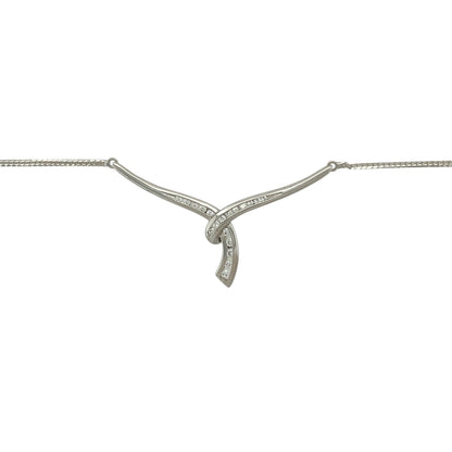 Bring refined sparkle and contemporary elegance to your collection with this pre-owned 9ct white gold cubic zirconia wrap-over Y-shaped necklace—an eye-catching piece designed to sit gracefully along the neckline.

Design: This stylish necklace features a wrap-over Y-shaped drop adorned with bright cubic zirconia stones, creating a sleek, elongated silhouette that catches the light beautifully. The modern design adds movement and sophistication, making it perfect for both day and evening wear.