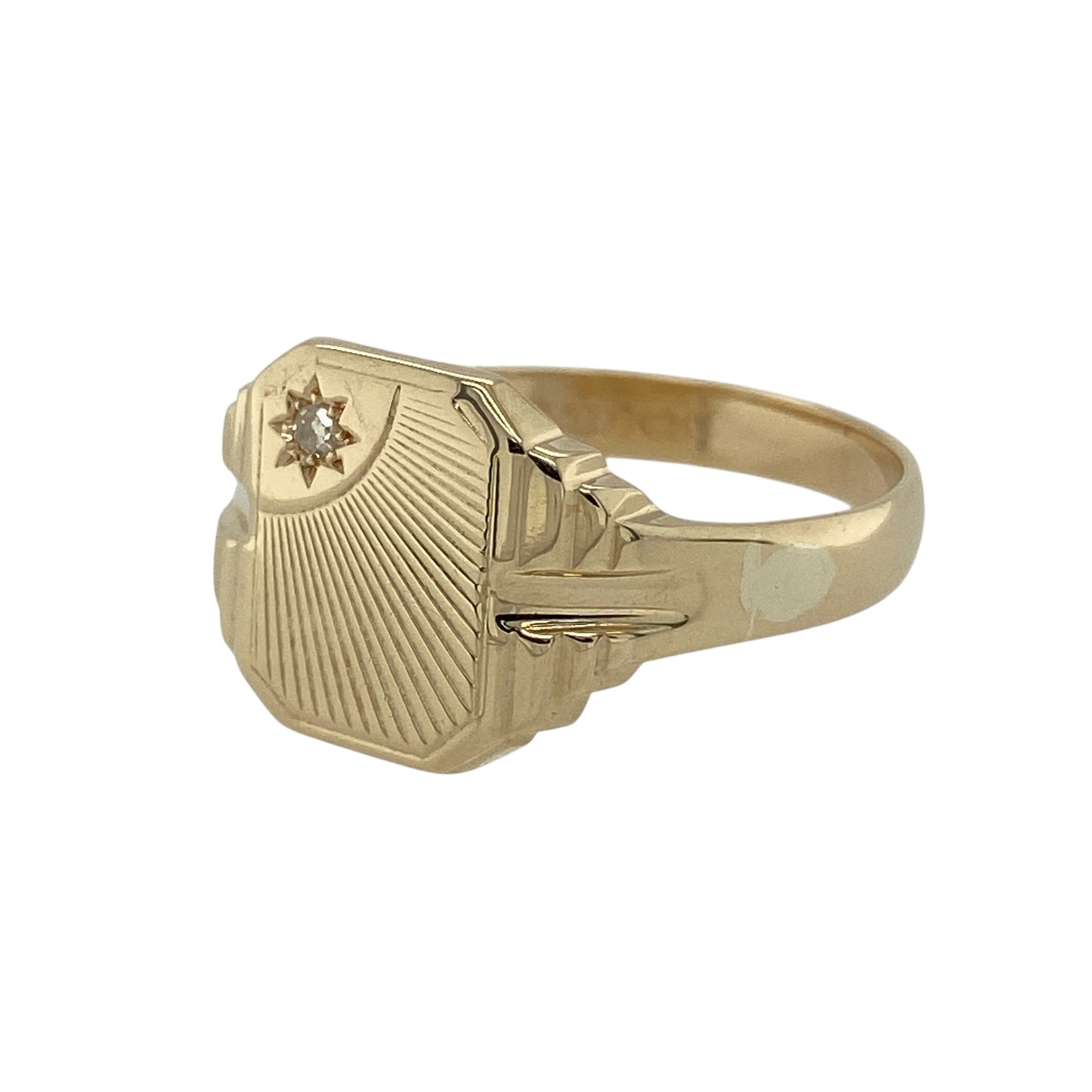 Bring bold presence and refined sparkle to your collection with this pre-owned 9ct yellow gold diamond set patterned signet ring—an elegant piece that elevates a classic style with subtle brilliance.

Design: The ring features a 13mm-high signet front adorned with an intricate patterned design, enhanced by diamond accents that add gentle sparkle and depth. The patterning gives the ring a distinctive character while maintaining the timeless appeal of a traditional signet.