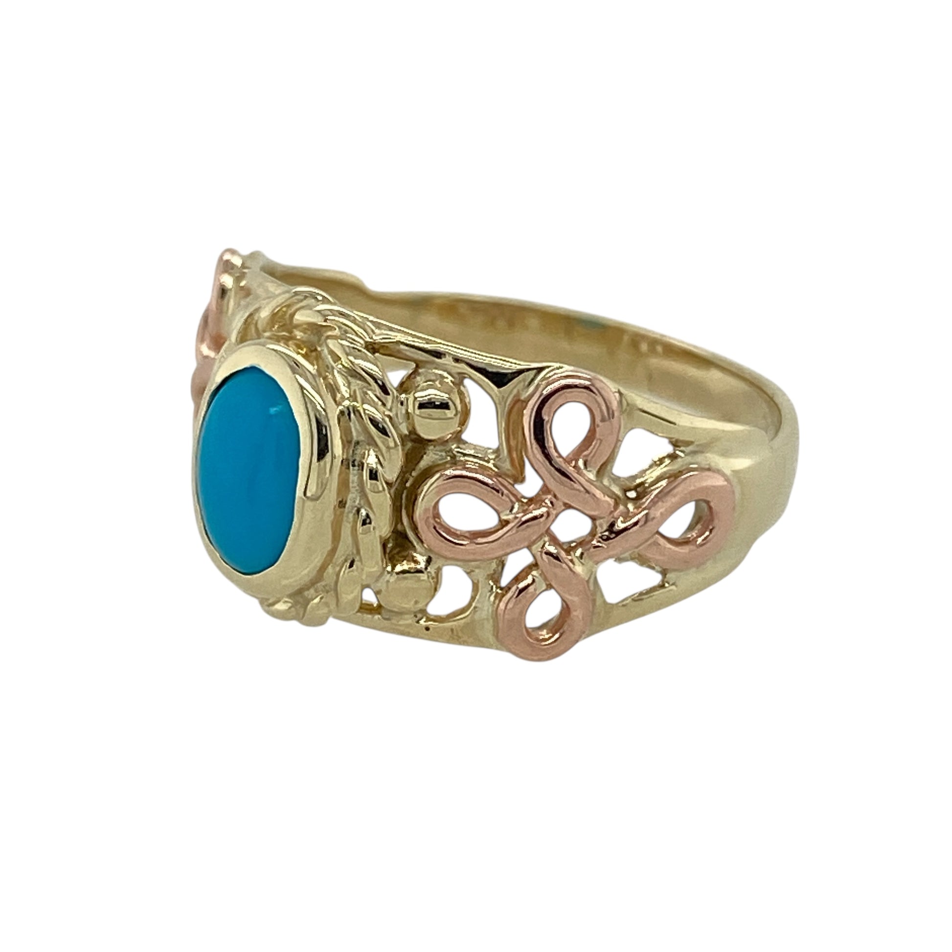 Bring vibrant colour and meaningful heritage to your collection with this pre-owned 9ct Welsh Cymru metal gold and turquoise Celtic ring—an expressive piece that blends traditional symbolism with striking gemstone beauty.

Design: This elegant ring features a 7mm by 4mm oval turquoise stone at the centre, offering bright blue colour and a bold focal point. The gemstone is framed by a Celtic-inspired design, adding depth, texture, and timeless cultural symbolism.