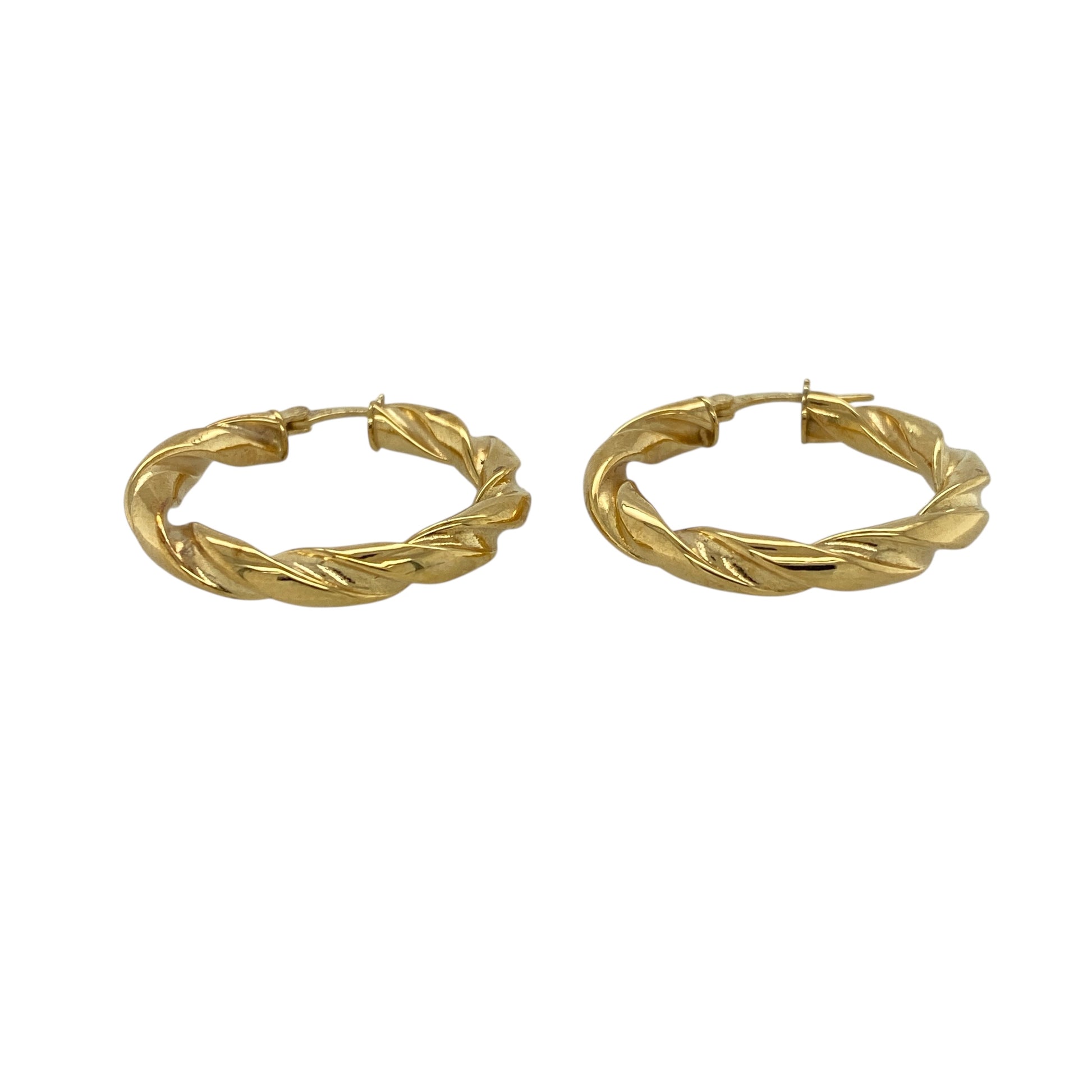 Bring classic style and elegant texture to your collection with these pre-owned 9ct yellow gold twisted hoop creole earrings—timeless pieces with a refined, polished finish.

Design: These hoops feature a twisted creole design, adding subtle texture and visual interest while maintaining a clean, traditional silhouette. Their smooth curvature and polished surface create a warm, radiant shine.