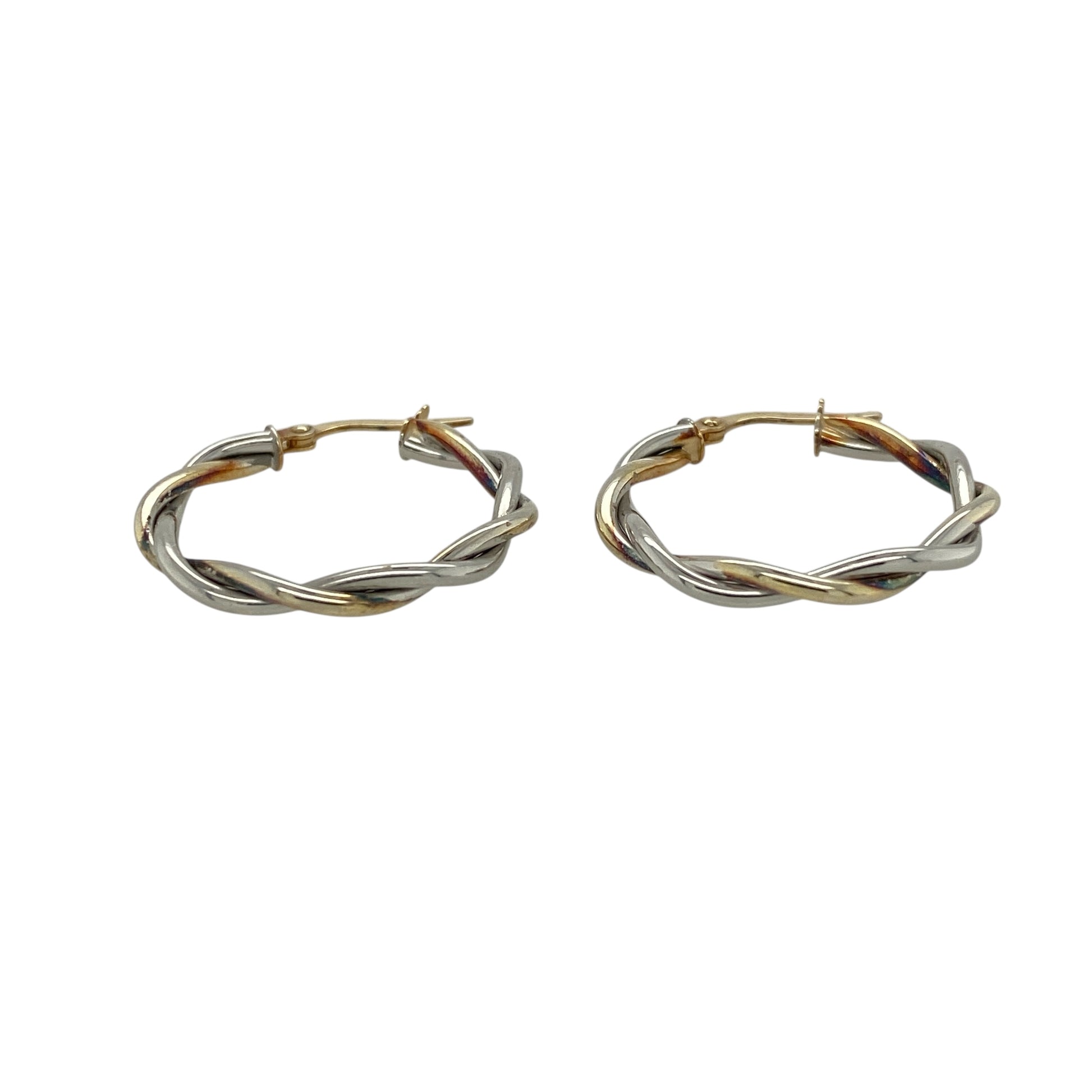 Bring modern elegance and refined simplicity to your collection with these pre-owned 9ct white gold twisted hoop creole earrings—stylish pieces with a clean, contemporary look.

Design: These hoops feature a subtle twisted creole design, adding gentle texture and visual interest while maintaining a sleek, classic silhouette. Their polished finish enhances the twist, creating a bright and sophisticated shine.
