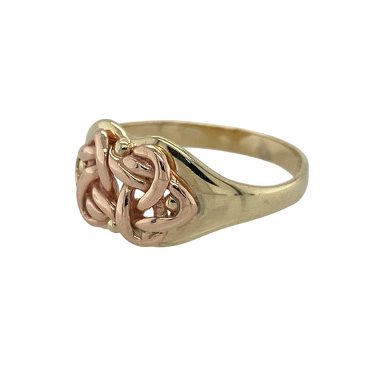 Bring meaningful heritage and elegant symbolism to your collection with this pre-owned 9ct yellow and rose Welsh Cymru gold Celtic knot ring—an expressive piece rooted in tradition and timeless design.

Design: The front of the ring measures approximately 9mm high and features an intricate Celtic knot motif, symbolising unity and eternity. The detailed knotwork creates a bold yet graceful focal point with strong cultural significance.