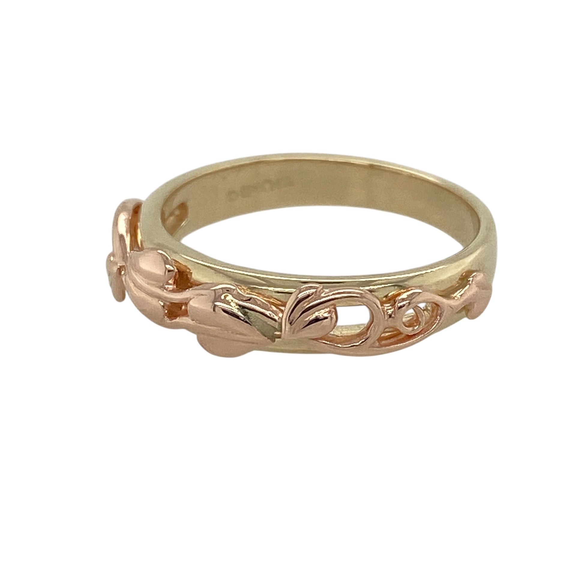 Bring meaningful symbolism and elegant two-tone style to your collection with this pre-owned 9ct yellow and rose gold Clogau Tree of Life band ring—an iconic design celebrating growth, strength, and connection.

Design: The front of the band measures 5mm wide and features the signature Tree of Life motif, with flowing branches and leaves creating a beautifully detailed and expressive pattern. The balanced design offers timeless appeal with symbolic depth.
