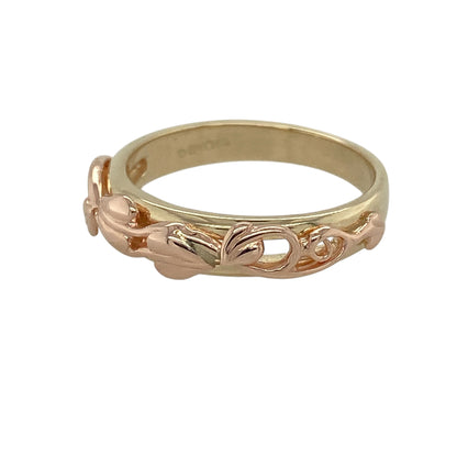 Bring meaningful symbolism and elegant two-tone style to your collection with this pre-owned 9ct yellow and rose gold Clogau Tree of Life band ring—an iconic design celebrating growth, strength, and connection.

Design: The front of the band measures 5mm wide and features the signature Tree of Life motif, with flowing branches and leaves creating a beautifully detailed and expressive pattern. The balanced design offers timeless appeal with symbolic depth.