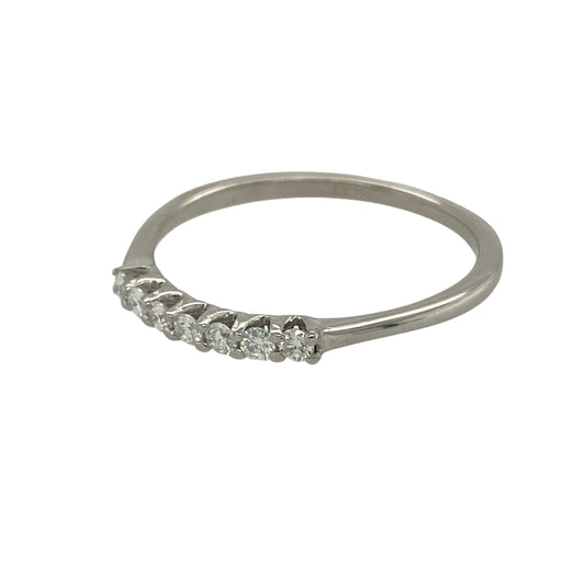 Bring classic sparkle and refined elegance to your jewellery collection with this pre-owned 9ct white gold & diamond set seven stone band ring, offering a timeless and versatile design.

Design: The ring features seven diamonds arranged in a neat row across the band, creating a balanced and elegant look with continuous sparkle.
Material: Made from 9-carat white gold, the bright polished finish enhances the brilliance of the diamonds and gives the ring a clean, modern appearance.