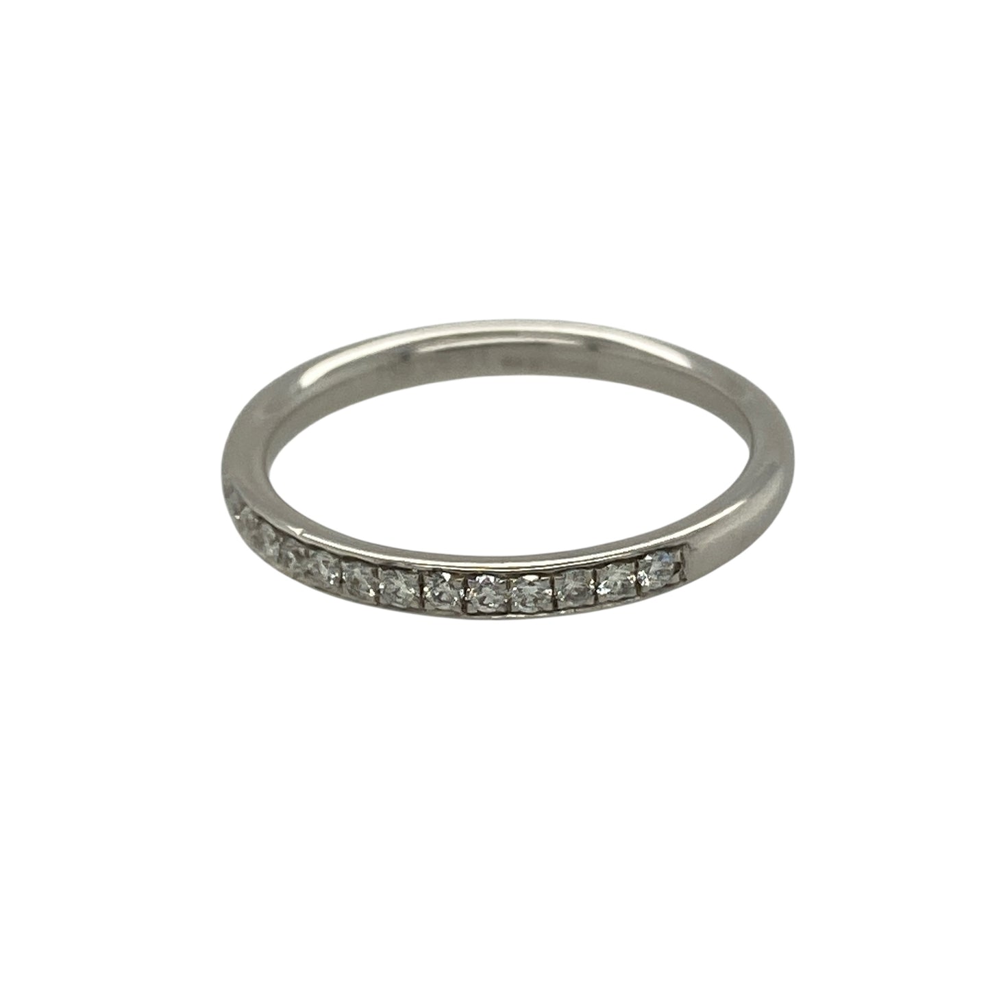 Bring refined elegance and timeless sparkle to your jewellery collection with this pre-owned 18ct white gold & diamond set band ring, offering a classic design with understated brilliance.

Design: The ring features a slim band with diamonds grain set across half of the band, creating a delicate line of sparkle with a clean and elegant profile.
Material: Made from 18-carat white gold, the bright polished finish enhances the diamonds and adds a luxurious, contemporary feel.