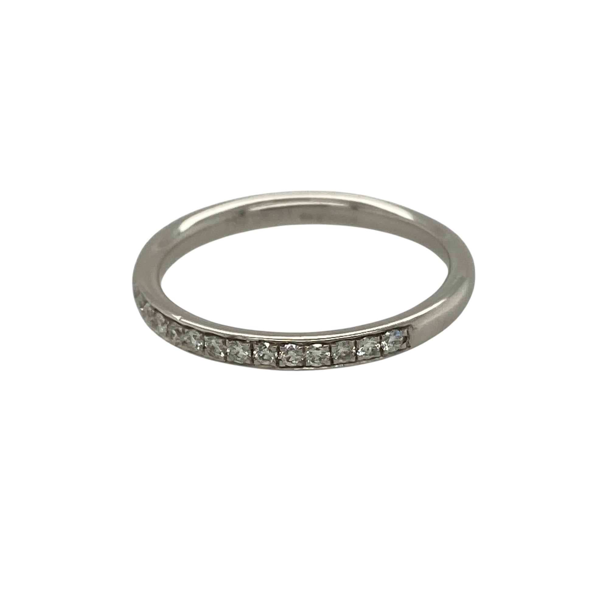 Bring refined elegance and timeless sparkle to your jewellery collection with this pre-owned 18ct white gold & diamond set band ring, offering a classic design with understated brilliance.

Design: The ring features a slim band with diamonds grain set across half of the band, creating a delicate line of sparkle with a clean and elegant profile.
Material: Made from 18-carat white gold, the bright polished finish enhances the diamonds and adds a luxurious, contemporary feel.