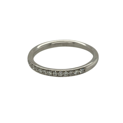 Bring refined elegance and timeless sparkle to your jewellery collection with this pre-owned 18ct white gold & diamond set band ring, offering a classic design with understated brilliance.

Design: The ring features a slim band with diamonds grain set across half of the band, creating a delicate line of sparkle with a clean and elegant profile.
Material: Made from 18-carat white gold, the bright polished finish enhances the diamonds and adds a luxurious, contemporary feel.