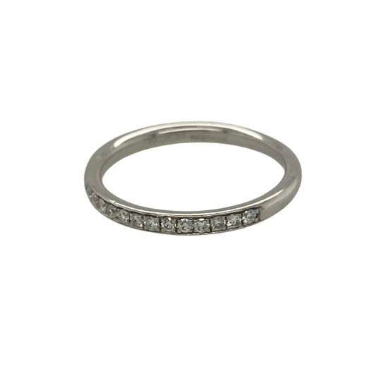 Bring refined elegance and timeless sparkle to your jewellery collection with this pre-owned 18ct white gold & diamond set band ring, offering a classic design with understated brilliance.

Design: The ring features a slim band with diamonds grain set across half of the band, creating a delicate line of sparkle with a clean and elegant profile.
Material: Made from 18-carat white gold, the bright polished finish enhances the diamonds and adds a luxurious, contemporary feel.