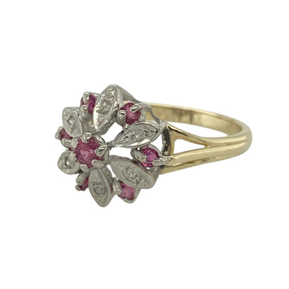 Bring elegant contrast and vibrant colour to your jewellery collection with this pre-owned 9ct yellow and white gold diamond & ruby set oval-shaped cluster ring, offering classic design with eye-catching detail.

Design: The ring features an oval-shaped cluster arrangement, combining rich red rubies and sparkling diamonds to create a striking and well-balanced focal point.