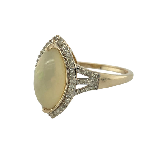 Bring luminous colour and elegant sparkle to your jewellery collection with this pre-owned 9ct yellow gold diamond & opalique set marquise ring, offering a striking and graceful design.

Design: The ring features a marquise-shaped opalique centre stone, surrounded by diamonds, with additional diamond detailing along the shoulders for added brilliance and refinement.