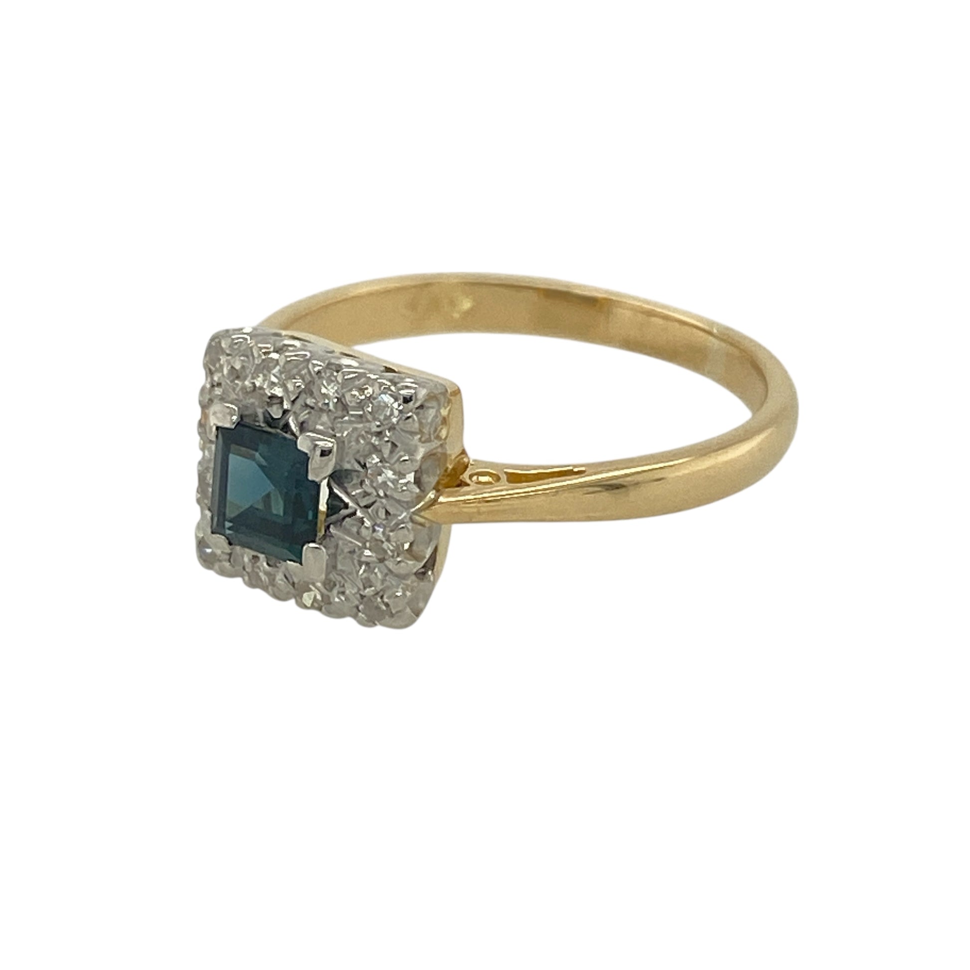 Bring classic elegance and rich colour to your jewellery collection with this pre-owned 18ct yellow gold diamond & blue stone set square cluster ring, offering timeless design with refined sparkle.

Design: The ring features a square-shaped cluster setting, centred with a vivid blue stone and surrounded by sparkling diamonds to create a balanced and eye-catching focal point.