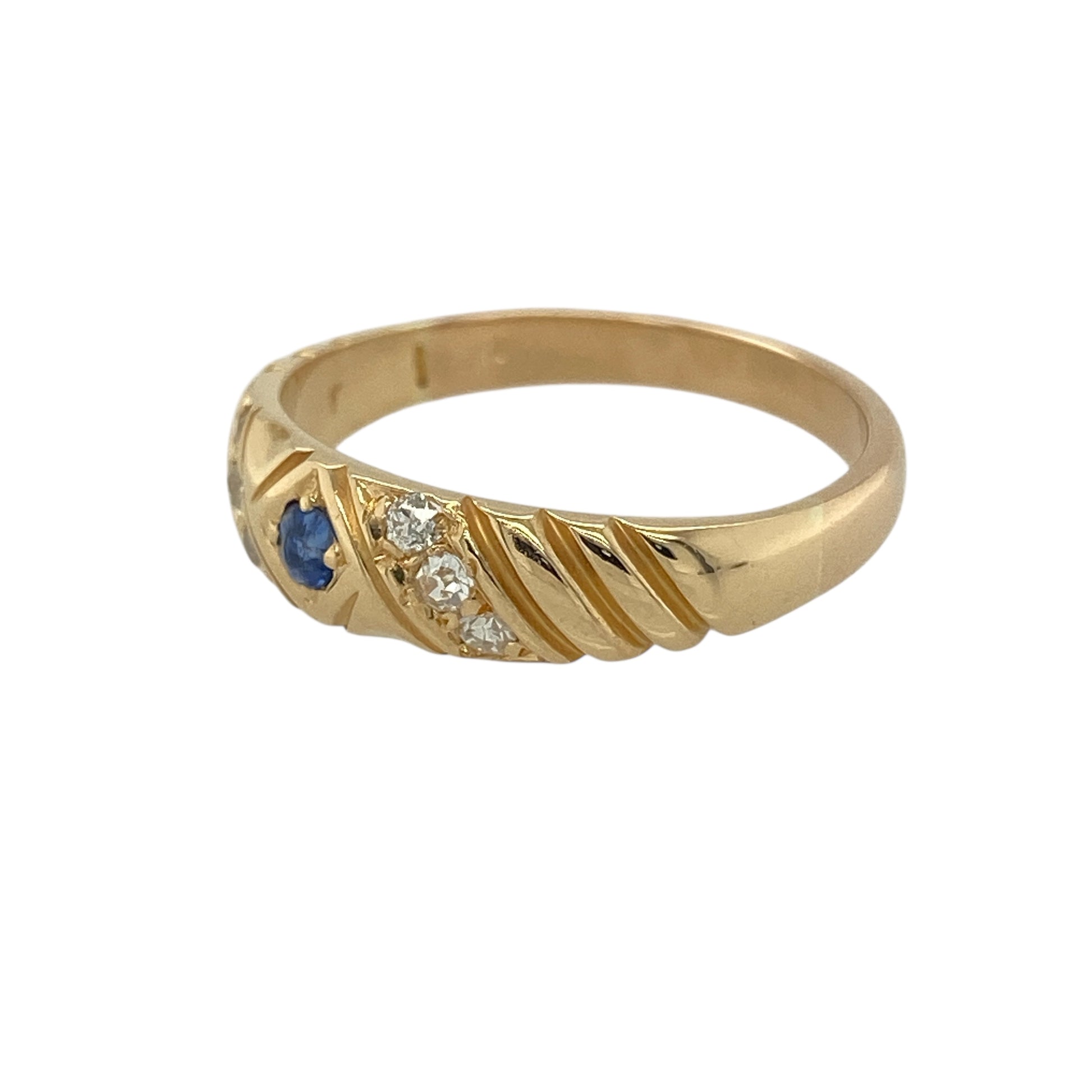 Bring refined colour and classic detail to your jewellery collection with this pre-owned 18ct yellow gold diamond & sapphire set ribbed band ring, offering timeless style with subtle texture.

Design: The ring features a ribbed band design, accented with a small sapphire and diamond detailing at the front, creating an elegant and understated look.
Material: Made from 18-carat yellow gold, the warm polished finish enhances the rich tone of the metal and complements the gemstone accents.