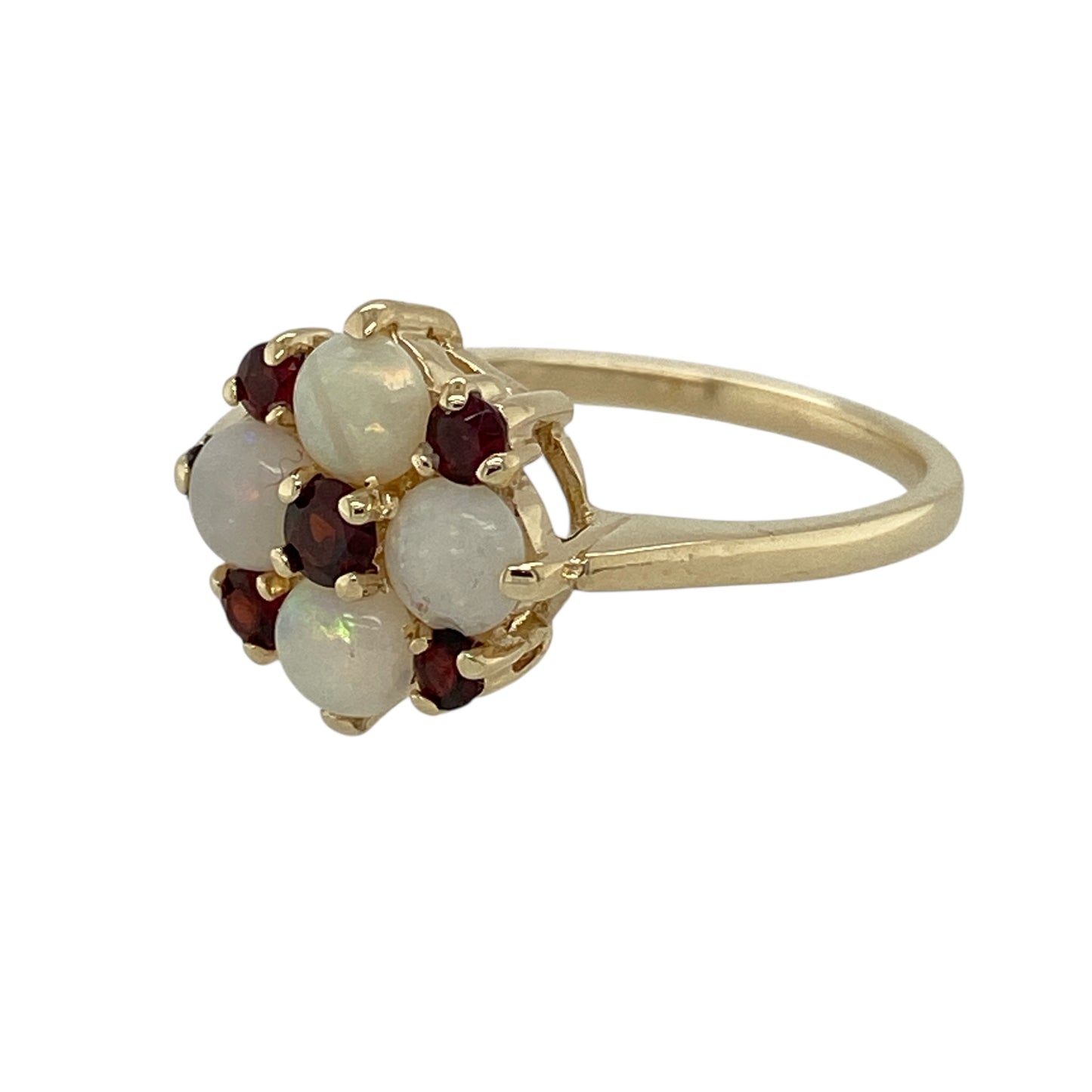 Bring soft iridescence and rich colour to your jewellery collection with this pre-owned 9ct yellow gold opalique & garnet set flower cluster ring, offering a beautifully balanced and elegant design.

Design: The ring features a floral cluster arrangement, combining shimmering opalique and deep red garnet stones to create a charming and eye-catching flower motif.
Material: Made from 9-carat yellow gold, the warm polished finish complements both the luminous opalique and the rich tones of the garnet.