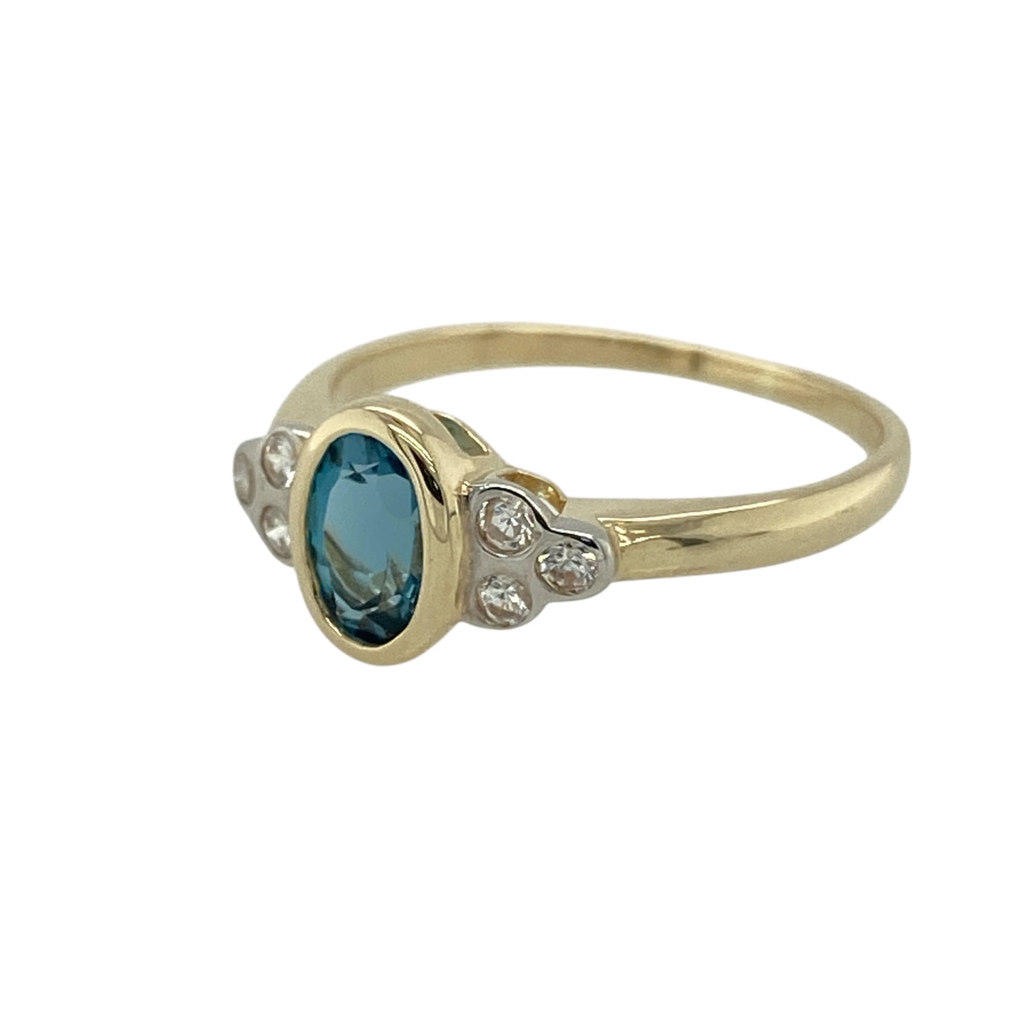 Bring fresh colour and delicate sparkle to your jewellery collection with this pre-owned 9ct yellow gold blue topaz & cubic zirconia set ring, offering an elegant and wearable design.

Design: The ring features an oval blue topaz at the centre, accented with cubic zirconia that add subtle brilliance and enhance the overall look.
Material: Made from 9-carat yellow gold, the warm polished finish beautifully complements the cool blue tones of the topaz and the sparkle of the cubic zirconia.