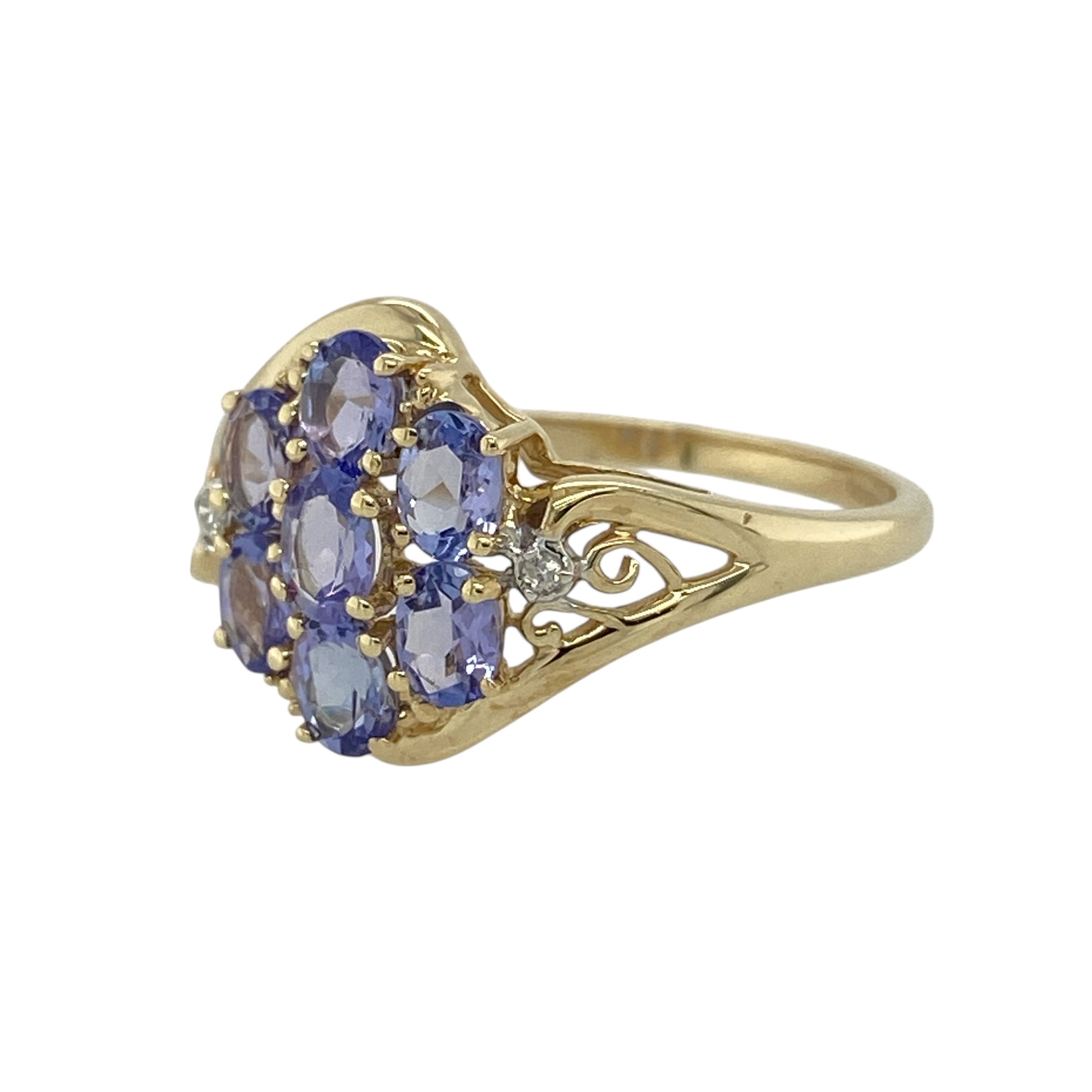 Bring captivating colour and elegant sparkle to your jewellery collection with this pre-owned 9ct yellow gold diamond & tanzanite set ring, offering refined design with a bold presence.

Design: The ring features an eye-catching arrangement of oval tanzanite stones accented with diamonds, creating a balanced and elegant focal display across the front.