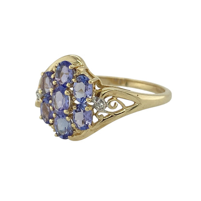 Bring captivating colour and elegant sparkle to your jewellery collection with this pre-owned 9ct yellow gold diamond & tanzanite set ring, offering refined design with a bold presence.

Design: The ring features an eye-catching arrangement of oval tanzanite stones accented with diamonds, creating a balanced and elegant focal display across the front.
