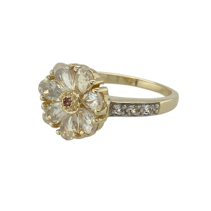 Bring vibrant colour and delicate sparkle to your jewellery collection with this pre-owned 9ct yellow gold ruby & cubic zirconia set flower ring, offering a charming and elegant floral design.

Design: The ring features a flower-inspired motif, with a small ruby at the centre and cubic zirconia forming the petals, creating a beautifully balanced and eye-catching floral focal point.