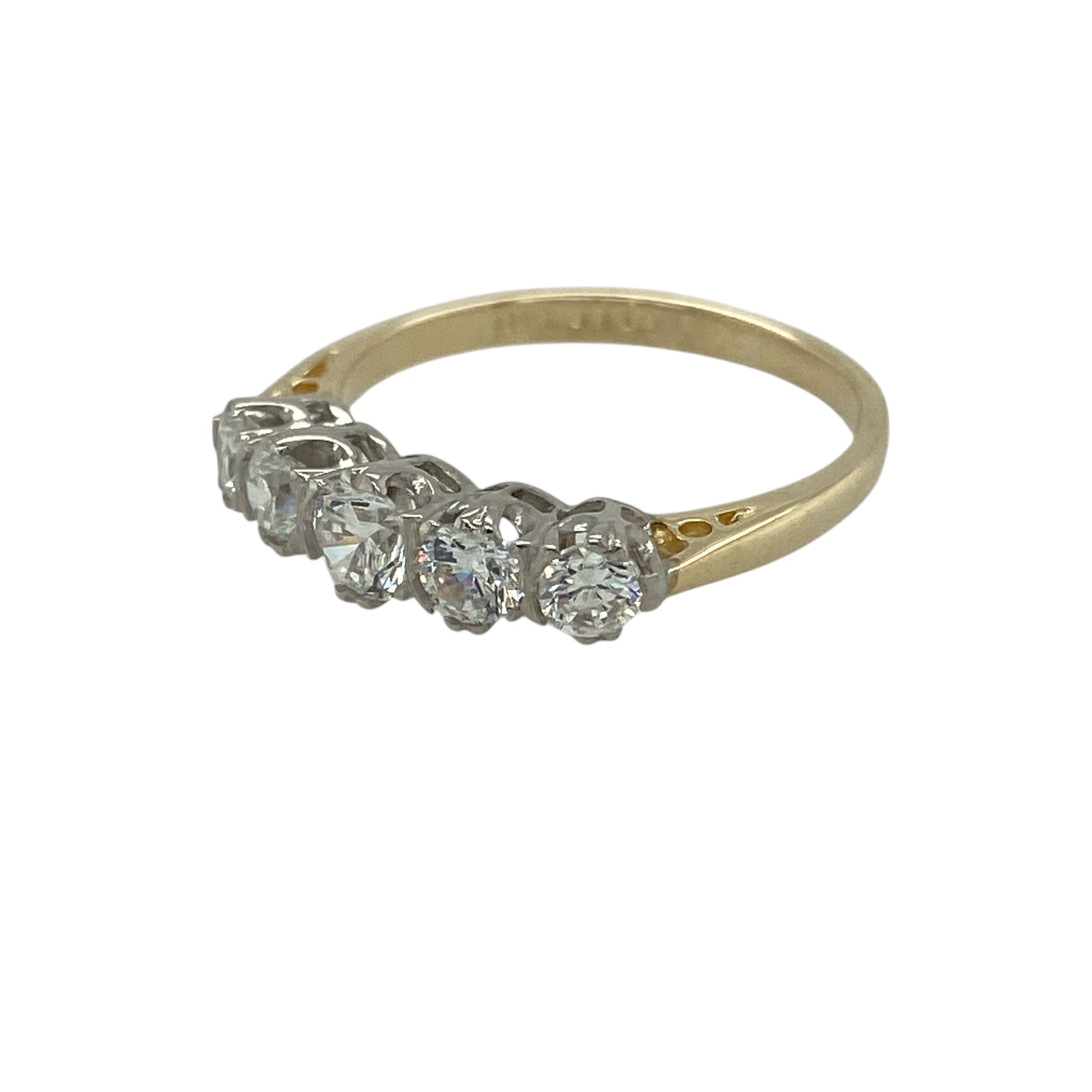 Bring classic sparkle and everyday elegance to your jewellery collection with this pre-owned 9ct yellow gold & cubic zirconia set five stone band ring, offering timeless style in a wearable design.

Design: The ring features a five stone arrangement across the front, creating a balanced and elegant band style with a continuous line of sparkle.
Material: Made from 9-carat yellow gold, the warm polished finish beautifully complements the bright cubic zirconia stones.