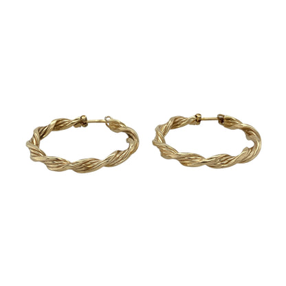 Bring classic style with a touch of texture to your jewellery collection with these pre-owned 9ct yellow gold twisted hoop creole earrings, offering timeless elegance with subtle detail.

Design: The earrings feature a twisted hoop creole design, adding gentle texture and visual interest to the traditional hoop silhouette.
Material: Made from 9-carat yellow gold, the warm polished finish enhances the twisted detailing and gives the earrings a rich golden glow.